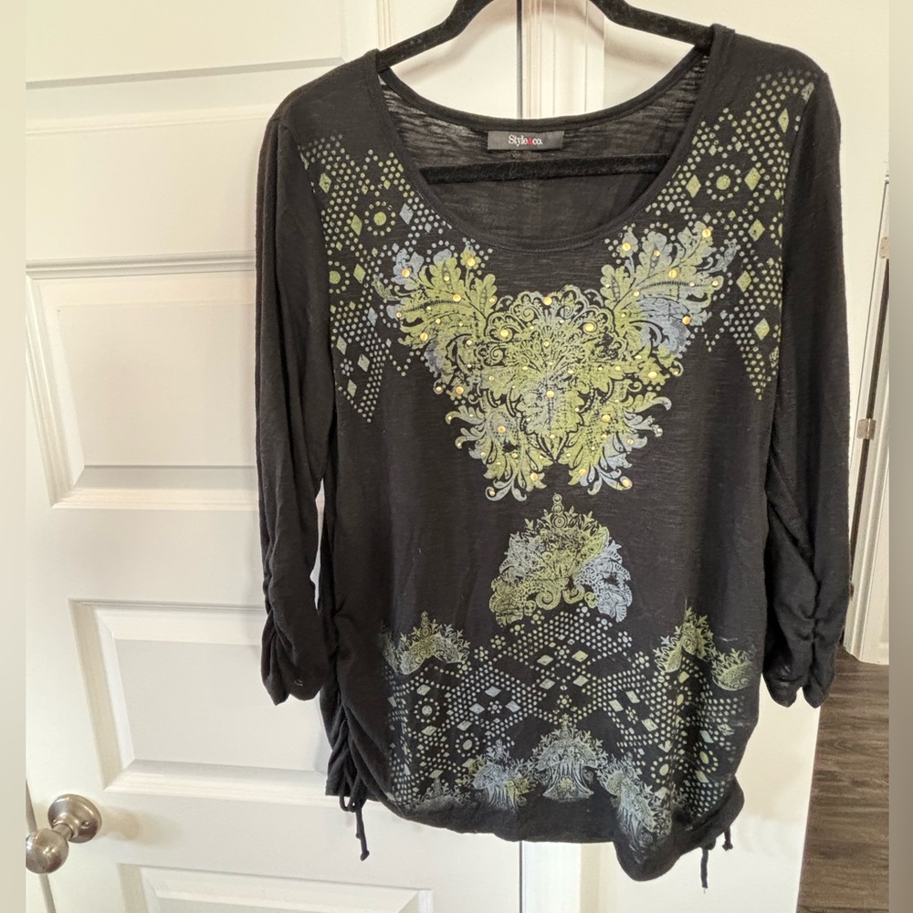 Large cotton black shirt with gold studs and gray emblem. Like new